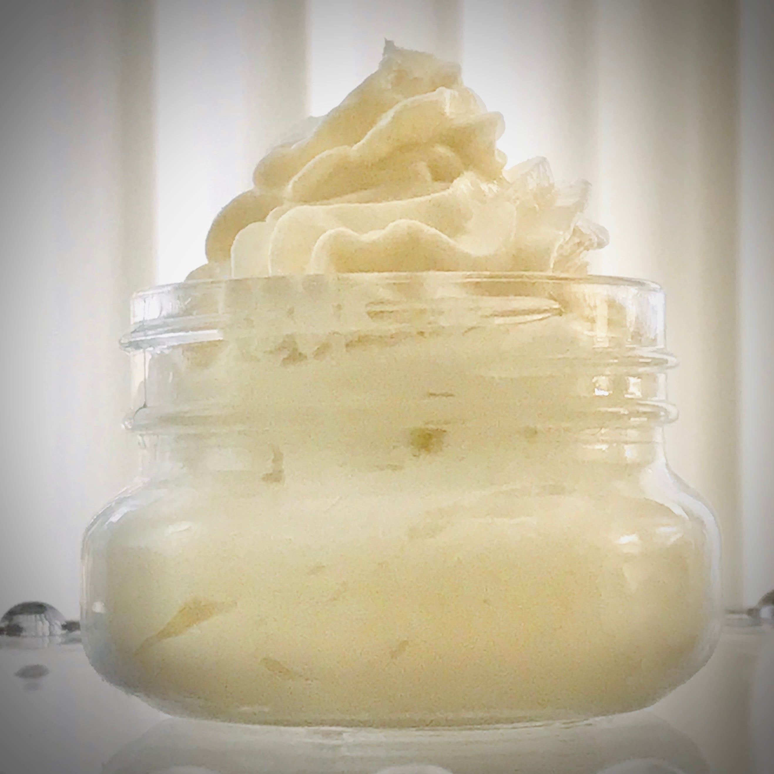 jar of whipped vanilla body butter in eco-friendly glass jar. Vegan, eco-friendly and cruelty-free